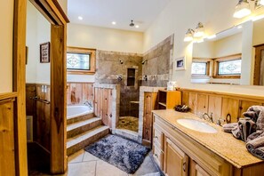 Jetted tub, hair dryer, towels, soap
