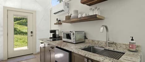 Coffee/tea maker, fridge, microwave, cookware/dishes/utensils