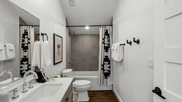 Jetted tub, hair dryer, towels, soap