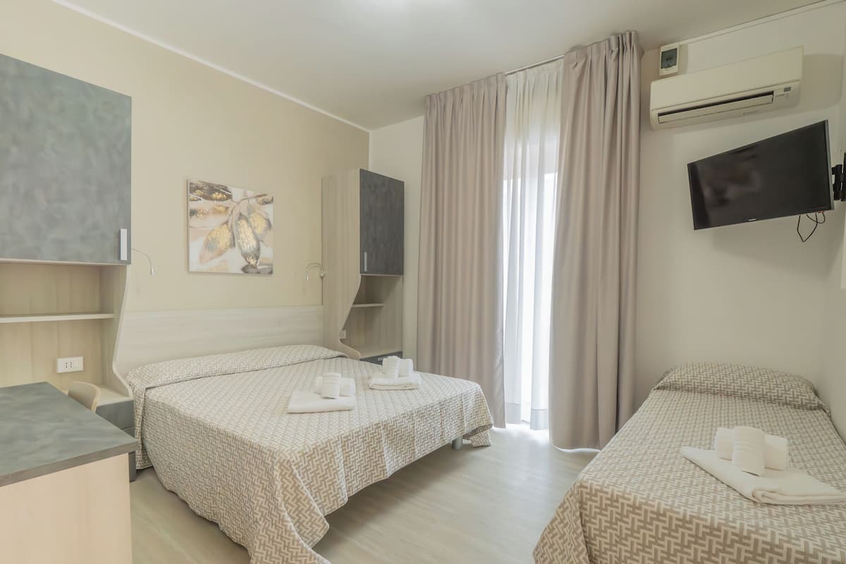 Triple Room, Balcony | In-room safe, laptop workspace, travel crib, free WiFi