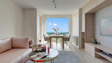 Deluxe-Apartment, 1 Schlafzimmer, Meerblick | Wohnbereich | Flachbildfernseher