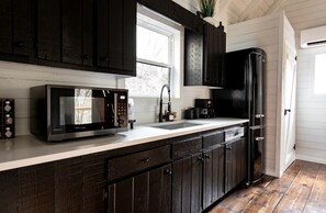 Fridge, microwave, stovetop, coffee/tea maker