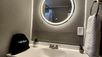 Jetted tub, hair dryer, towels, soap