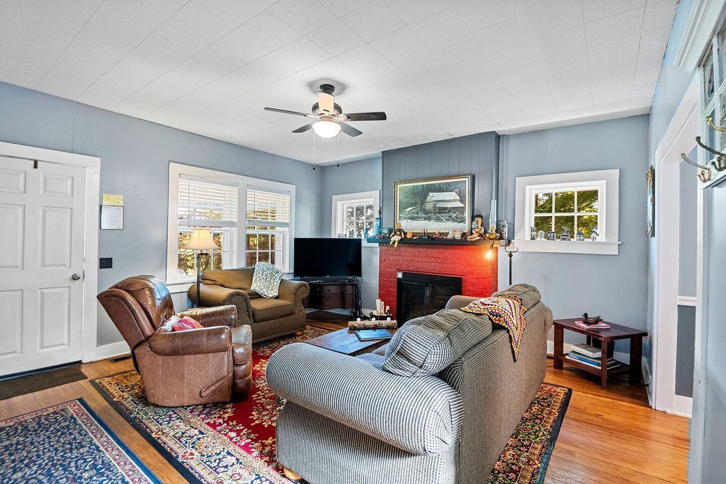 TV, fireplace, books