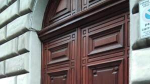 A large, ornate wooden double door with a brass lower section, set in a stone building. - Sixty one luxury room Apartment 100 sqm.,central, in prestigious area. (Roma)