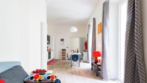 A modern apartment with a living room, dining area, and kitchen. - Sixty one luxury room Apartment 100 sqm.,central, in prestigious area. (Roma)