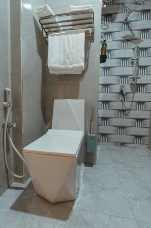 Comfort Suite, Balcony, City View | Bathroom | Shower, hair dryer, towels, soap