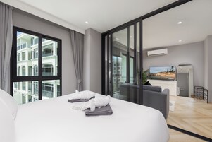Premium Suite, Balcony, Pool View | Laptop workspace, soundproofing, free WiFi, bed sheets
