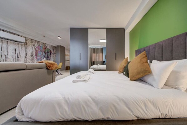 1 bedroom, desk, iron/ironing board, travel crib