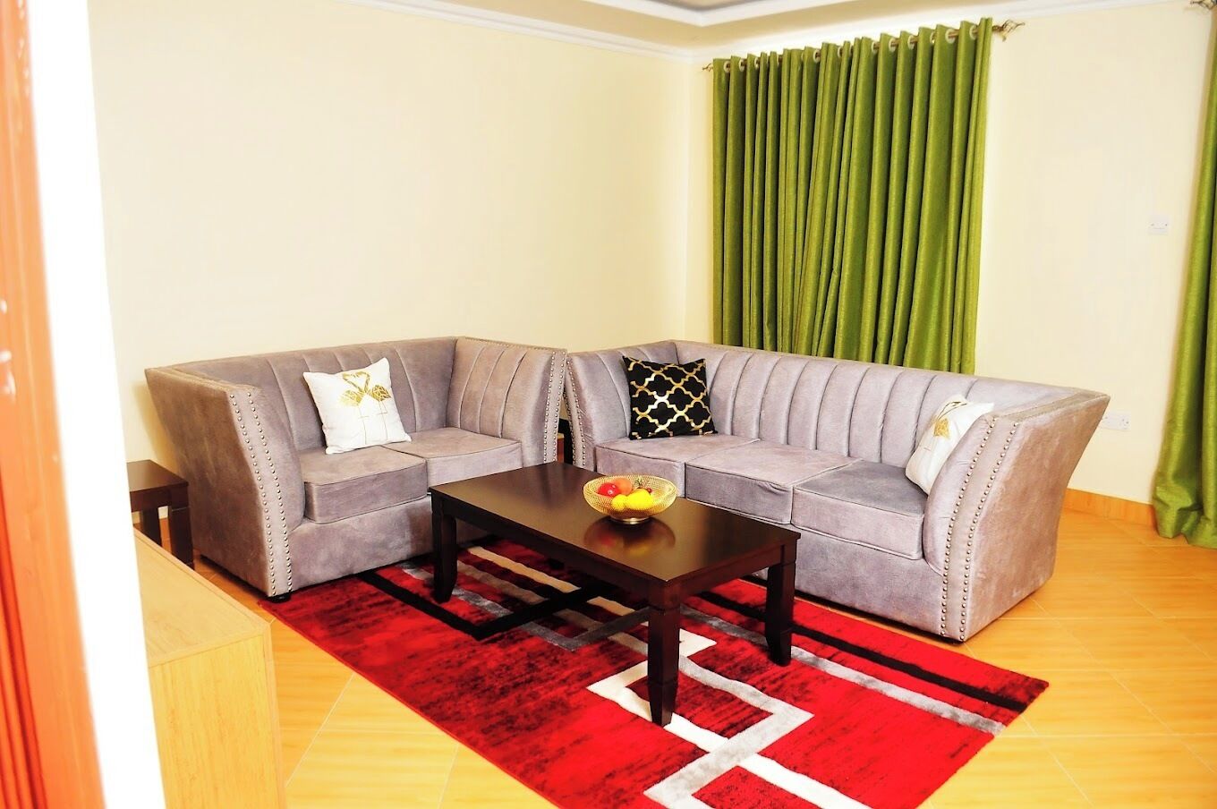 Departamento Deluxe, vista a la ciudad | Área de sala de estar | Smart TV de 32 pulgadas con canales digitales 