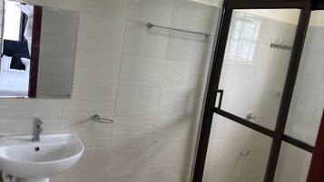 Family Apartment, City View | Bathroom | Shower, slippers, towels, soap