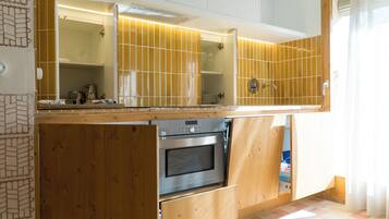 Standard Studio, Balcony, City View | Private kitchen | Toaster, highchair, griddle, dining tables