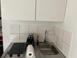 Microwave, stovetop, coffee/tea maker, cookware/dishes/utensils