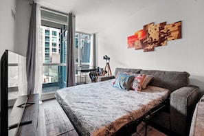 Deluxe Condo, 1 Bedroom, Balcony, City View | Living area | 43-inch flat-screen TV with satellite channels, Netflix - Atlantis at Waterpark City Condos in DT (Toronto)