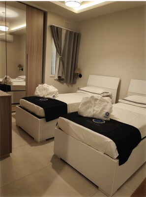 3 عدّة غرف نوم ومكواة/لوح كي وواي فاي وملاءات أسرّة