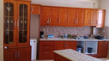 Fridge, stovetop, coffee/tea maker, electric kettle