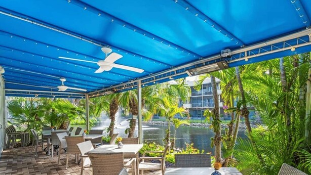 Outdoor dining - I-252 Updated With Views, Pool, & Near Beach! (Naples)