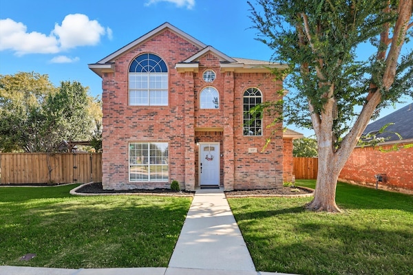 Fully decked out with indoor & outdoor entertainment options, this Parisian-themed Lewisville getaway is perfect for your next trip with 5 bedrooms & 2.5 bathrooms!