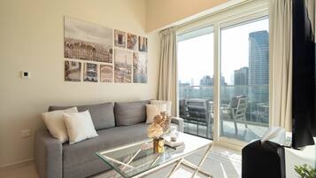 Deluxe Apartment, 2 Bedrooms | Living area | 125-inch Smart TV with cable channels, Netflix, streaming services