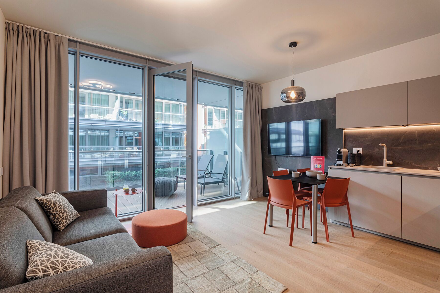 Basic Apartment | Living area | 30-cm TV with satellite channels