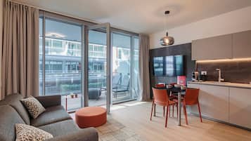 Appartamento Basic | Area soggiorno | TV 30 cm con canali satellitari