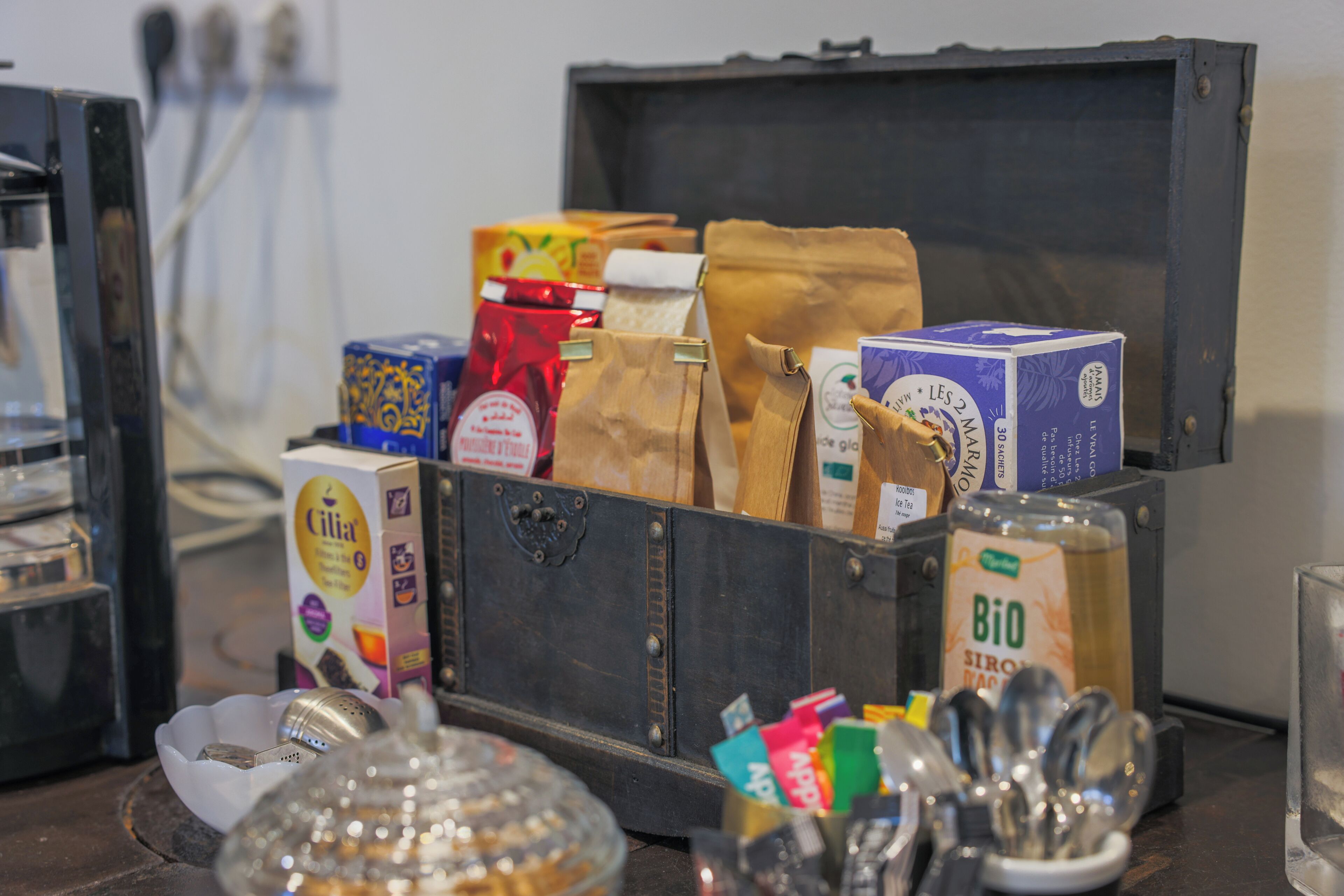 A storage box containing various food items and kitchen utensils.