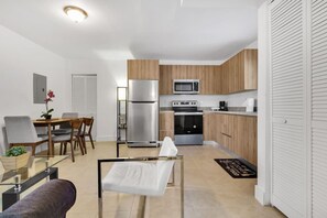 A compact living space with a kitchenette, a dining area, and a seating area. - ° Cozy Private 2 BR Apt 5min to Brickell  8th st ° (Miami)