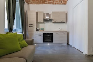 Appartamento, 1 camera da letto | Area soggiorno | TV 30 pollici con canali satellitari