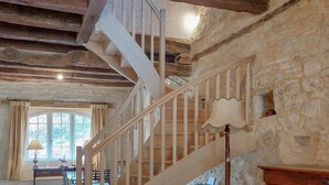 A wooden staircase with a white railing leading to a high ceiling. - Superbe maison avec piscine (Montgesty)