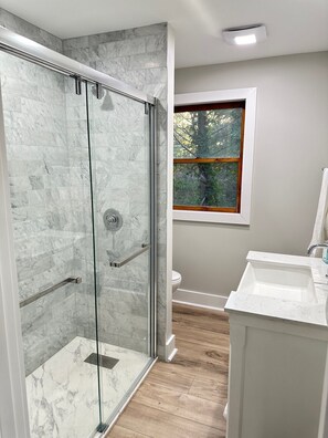 Shower, hair dryer, towels, soap