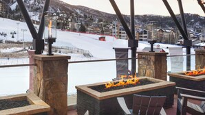 A snow-covered outdoor area with a fire pit and seating. - Charming 2-bedroom Ski-in, Ski-out resort in lovely Steamboat Springs (Steamboat Springs)
