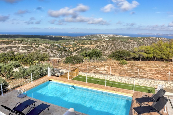 Outdoor space with spectacular views, swimming pool, sun beds and sitting areas