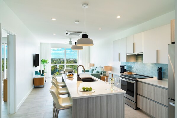 Jr Suite One Bedroom with Grace Bay Street View | Private kitchen
