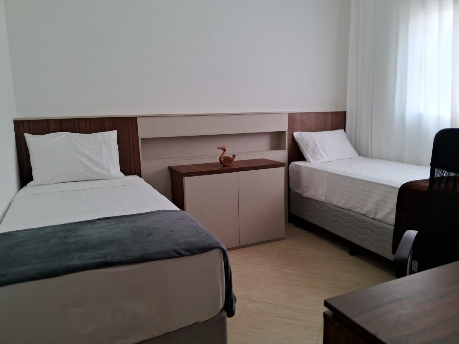 Basic Apartment | Desk, laptop workspace, blackout curtains, iron/ironing board