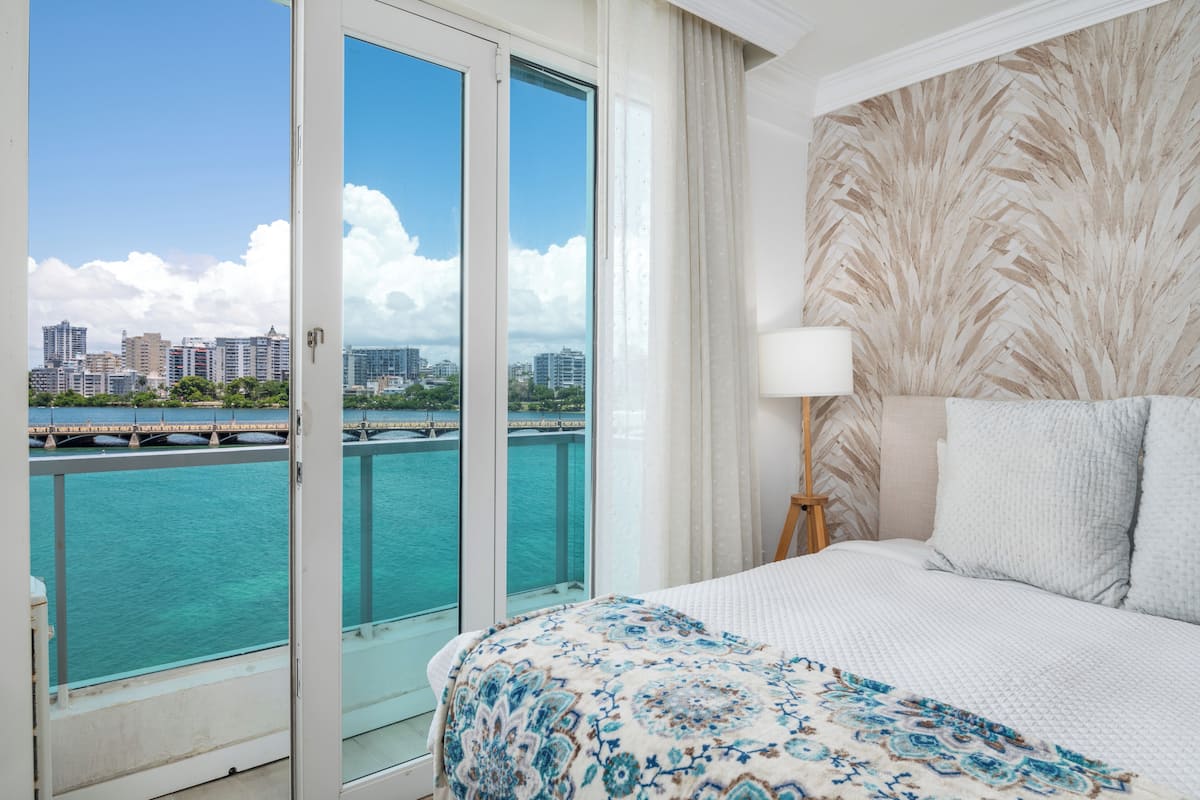 Deluxe Apartment, 1 King Bed, Lagoon View, Oceanfront | In-room safe, iron/ironing board, free WiFi, bed sheets