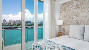 Deluxe Apartment, 1 King Bed, Ensuite, Oceanfront | Iron/ironing board, travel crib, WiFi (free), individually decorated