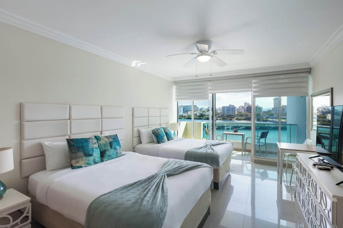 Deluxe Studio, 2 Queen Beds, Balcony, Ocean View | In-room safe, iron/ironing board, free WiFi, bed sheets