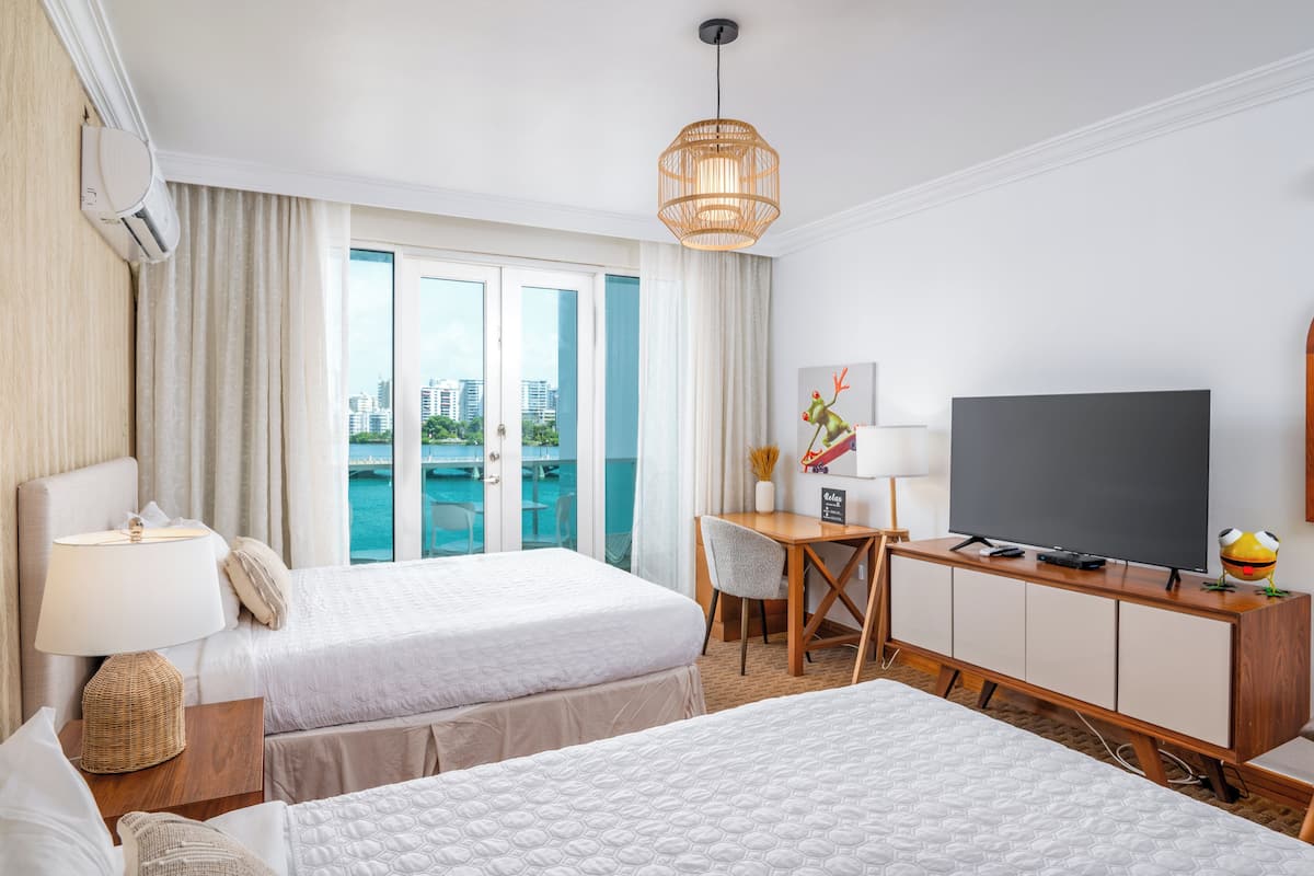 Deluxe Studio, 2 Queen Beds, Balcony, Lagoon View | In-room safe, iron/ironing board, free WiFi, bed sheets