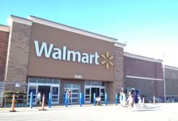 A Walmart store with a large sign and a clear entrance.