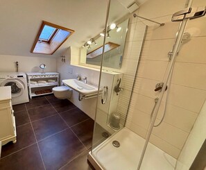 Shower, hair dryer, towels, toilet paper