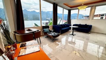 Penthouse, 2 Bedrooms, Kitchenette, Lake View | Living room | 42-inch flat-screen TV with digital channels, streaming services