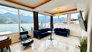 Penthouse, 2 Bedrooms, Kitchenette, Lake View | Living room | 42-inch flat-screen TV with digital channels, streaming services