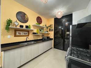 Private kitchen - Bright 3-Level Condo w/ AC, Rooftop Soaking Tub, Pool & Family Amenities (Solidaridad)
