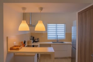 Fridge, microwave, stovetop, coffee/tea maker
