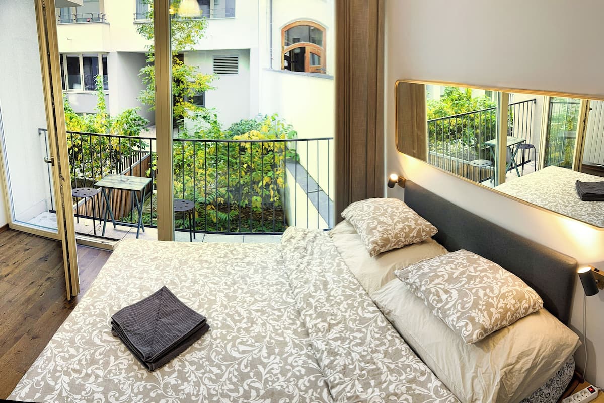 Superior Apartment, Courtyard Area | Desk, laptop workspace, blackout drapes, soundproofing