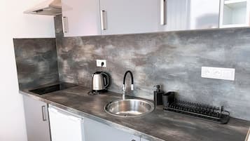 Superior Apartment, Courtyard Area | Private kitchen | Fridge, microwave, stovetop, cookware/dishes/utensils