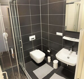 Shower, free toiletries, hair dryer, towels