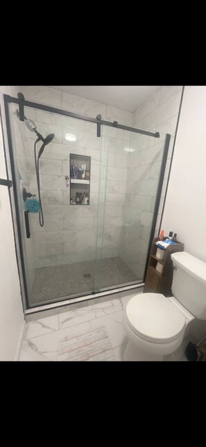 Shower, hair dryer, towels, soap