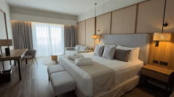 Deluxe Room, 1 King Bed, Balcony, Garden View | Free minibar, in-room safe, desk, laptop workspace
