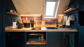 Fridge, microwave, stovetop, coffee/tea maker